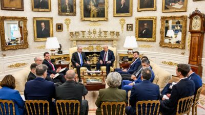 President Trump and Prime Minister Netanyahu meet with aides in a White House room