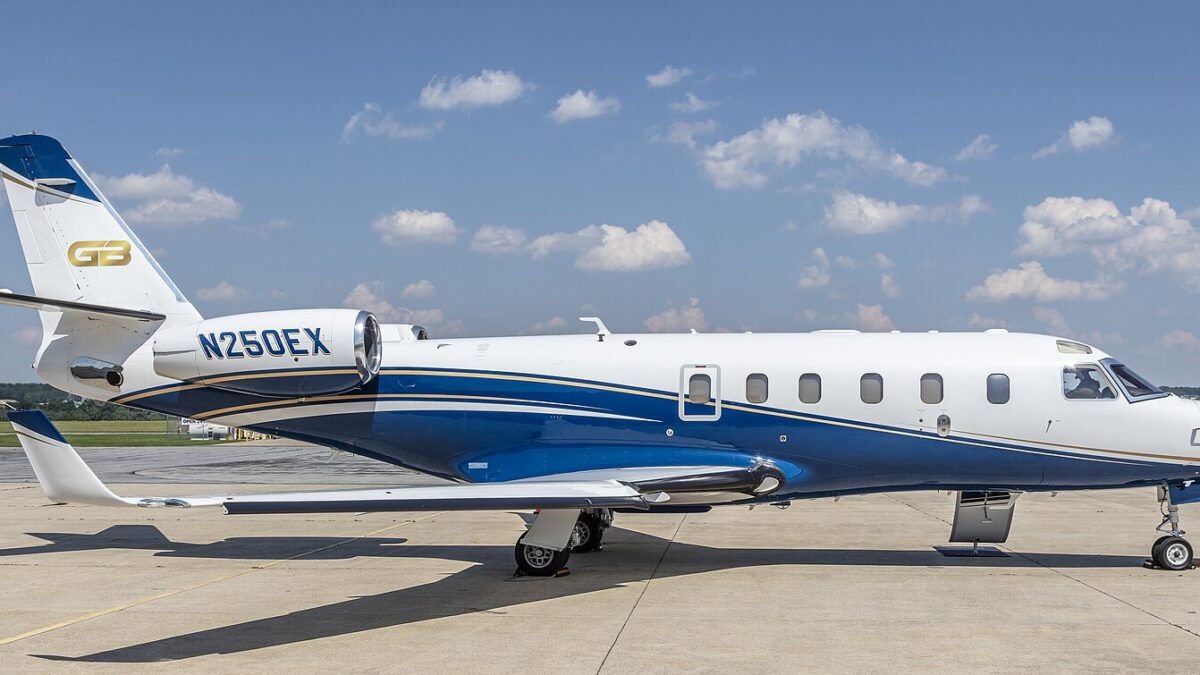 A Gulfstream G100 business jet parked on an airport apron