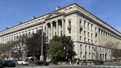 The Robert F. Kennedy Department of Justice Building in Washington, D.C., on a clear spring day