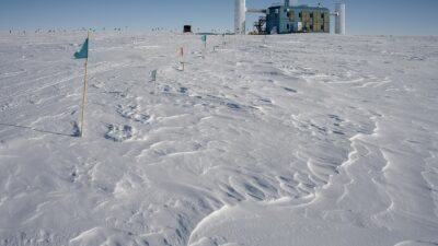 The IceCube Neutrino Observatory laboratory building on the snowfields of the South Pole