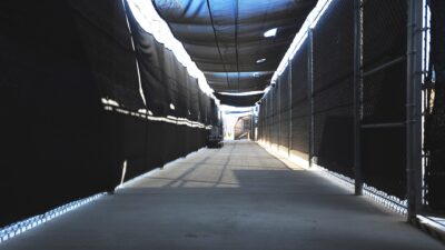 A fenced and screened walkway at the Expeditionary Legal Complex, the military commissions court site at Guantanamo Bay, Cuba