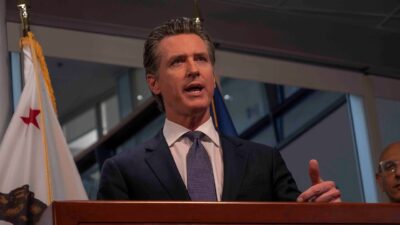 California Governor Gavin Newsom speaking at a podium