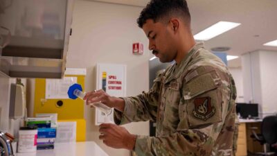 Pharmacy staff filling prescription medications