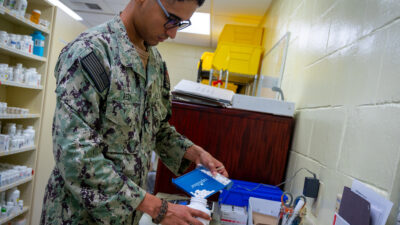 U.S. Navy pharmacy technician with medication