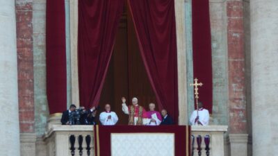 Pope Leo XIV waves from the central balcony of St. Peter's Basilica