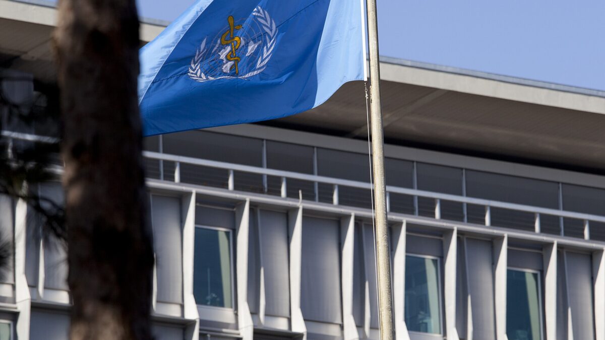 World Health Organization headquarters building and flag in Geneva