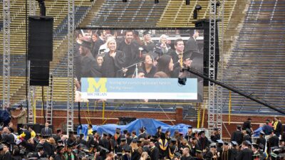 Graduates in caps and gowns at a University of Michigan commencement ceremony