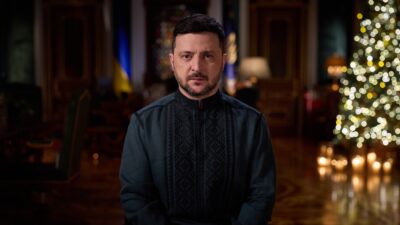 Ukrainian President Volodymyr Zelenskyy speaking at a podium